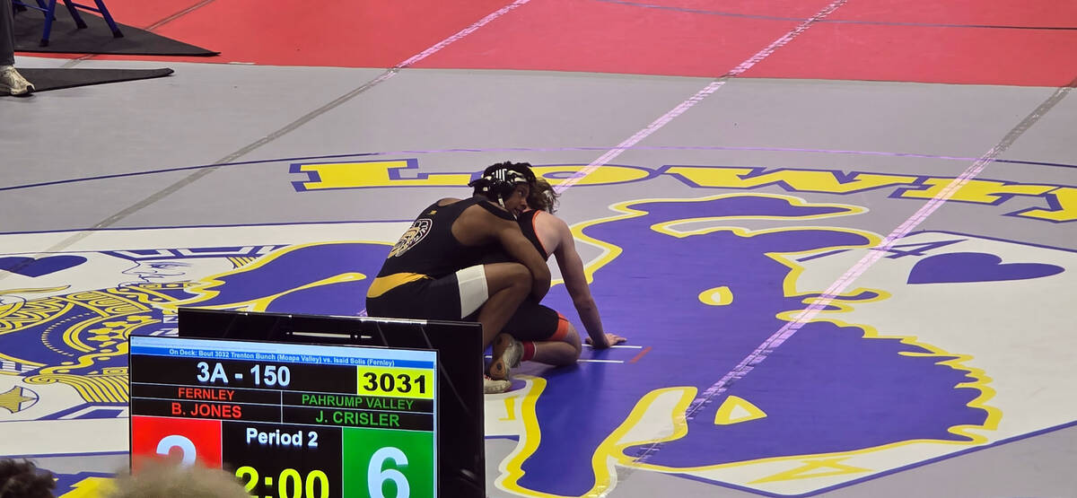 Trojans Jayden Crisler goes up against his opponent from Fernley High School up north in Winne ...