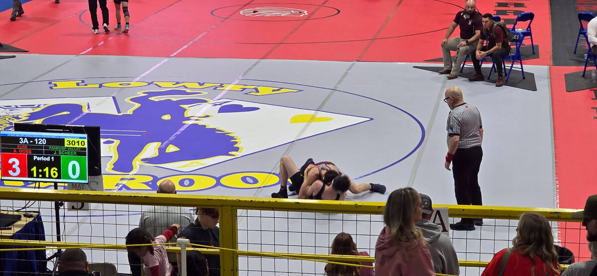 Trojan Joseph Scheer goes up against his opponent from Elko up north in Winnemucca during the C ...