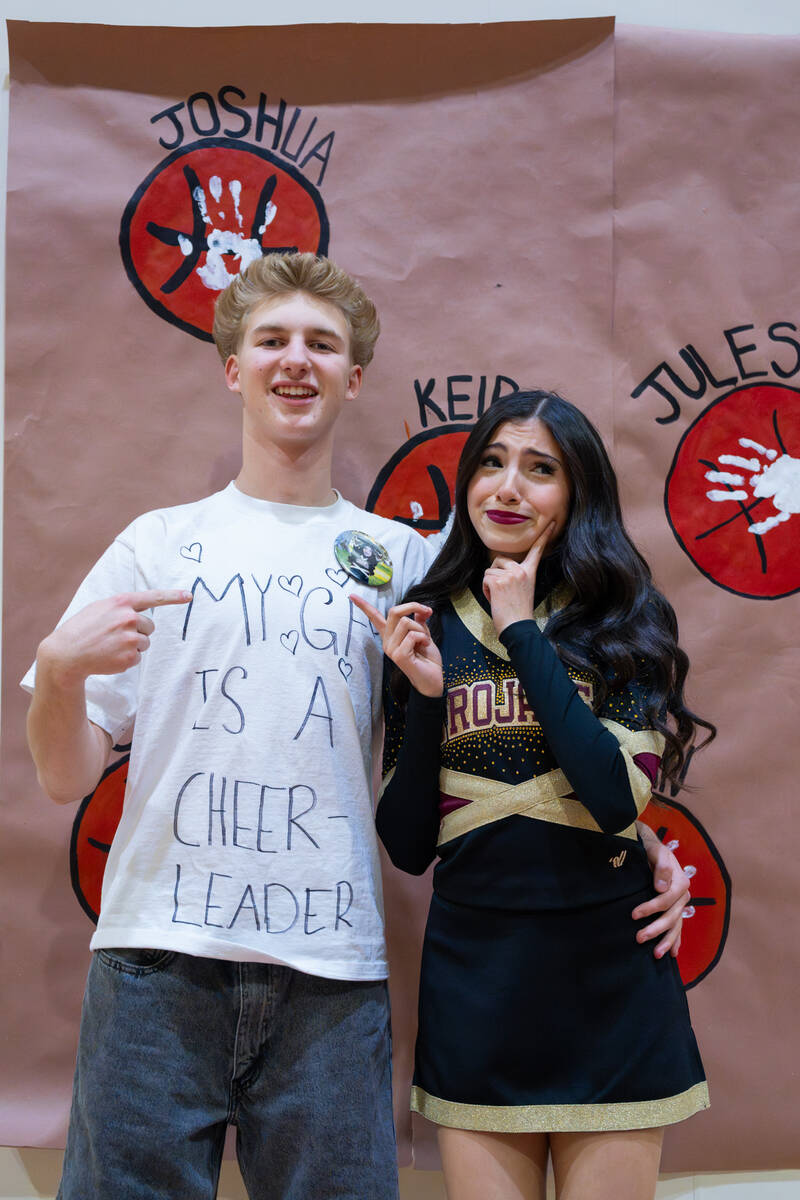Pahrump Valley High School's Eva Armendariz and her boyfriend Tyler Murphy pose together with M ...