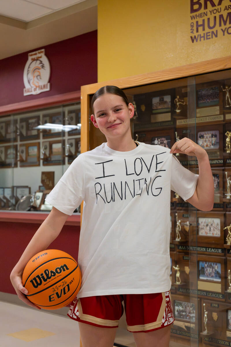 Pahrump Valley High School sophomore Ella Odegard shows off her comedic "I Love Running" white ...