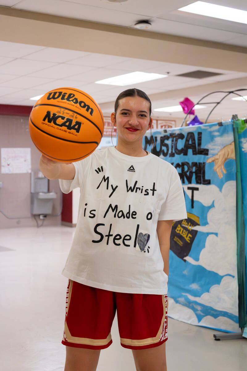 Pahrump Valley High School freshman Olivia Veloz shows off her custom made T-shirt that reads " ...