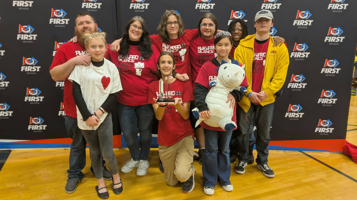 The Awkward Silence 4H Robotics team proudly displays an award earned at state competition at G ...