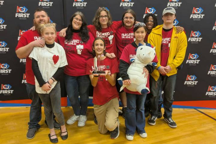 The Awkward Silence 4H Robotics team proudly displays an award earned at state competition at G ...