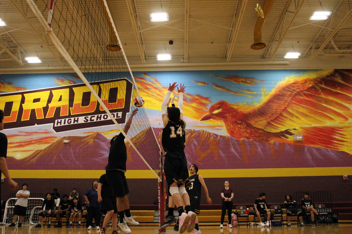 Pahrump Valley High School freshman Blake Edie-Dixon attempts to put a block on an El Dorado pl ...