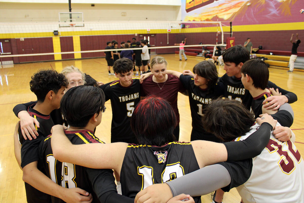 The Pahrump Valley High School Jv volleyball team huddles together before their first exhibitio ...
