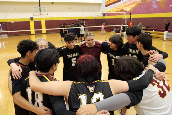 The Pahrump Valley High School Jv volleyball team huddles together before their first exhibitio ...