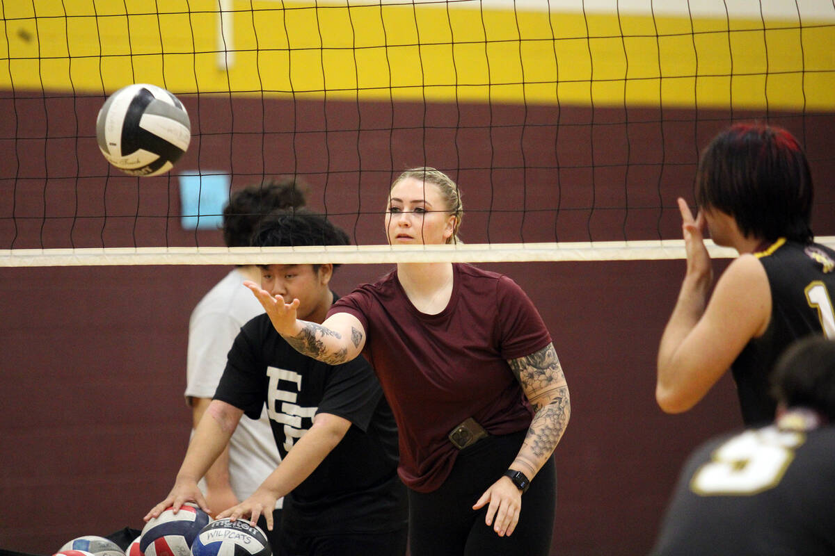 Pahrump Valley High School JV head coach Andi Bishop leads warm ups with the program before the ...