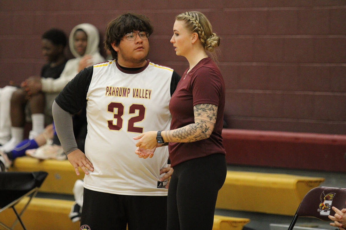 Pahrump Valley High School junior Daniel Chavez gets some in-game advice from Trojan JV head co ...
