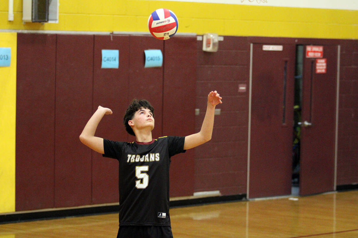A Pahrump Valley High School JV setter prepares to send the ball over the net during the Trojan ...