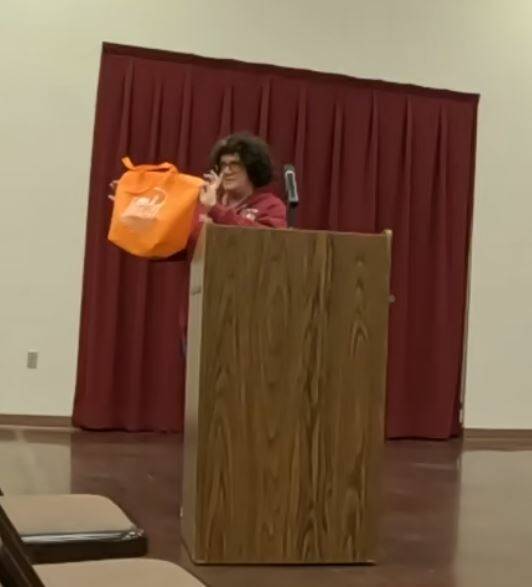 Ginny Faulkner of the Beatty Chamber of Commerce shows Beatty's 'merch' for sale in the town of ...