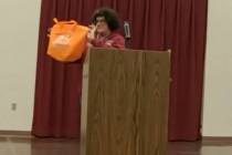 Ginny Faulkner of the Beatty Chamber of Commerce shows Beatty's 'merch' for sale in the town of ...