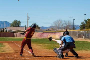 Pahrump Valley High School junior Cody Fried gets a hold of the ball sending it to right field ...