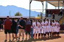 Pahrump Valley High School's 2026 varsity softball program lines up on the foul lines prior to ...