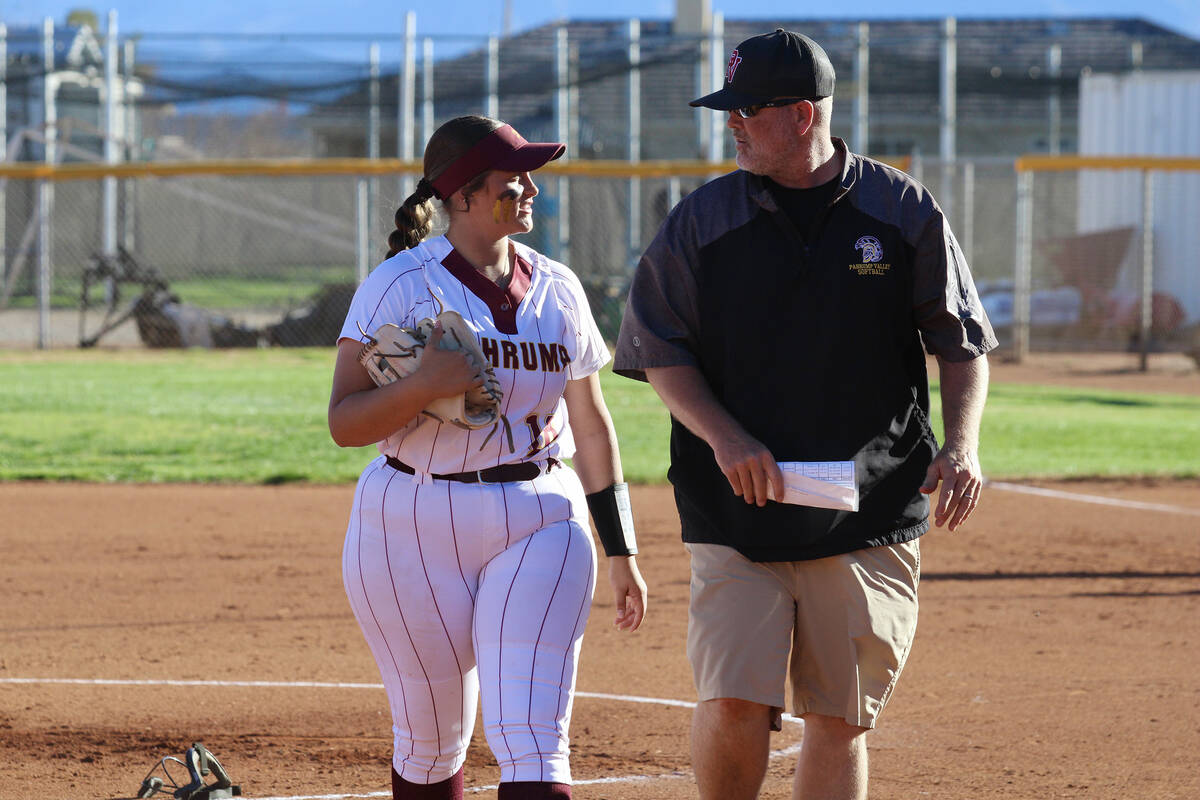 Pahrump Valley High School junior Evalenne Armendariz talks with head coach Brian Hayes during ...