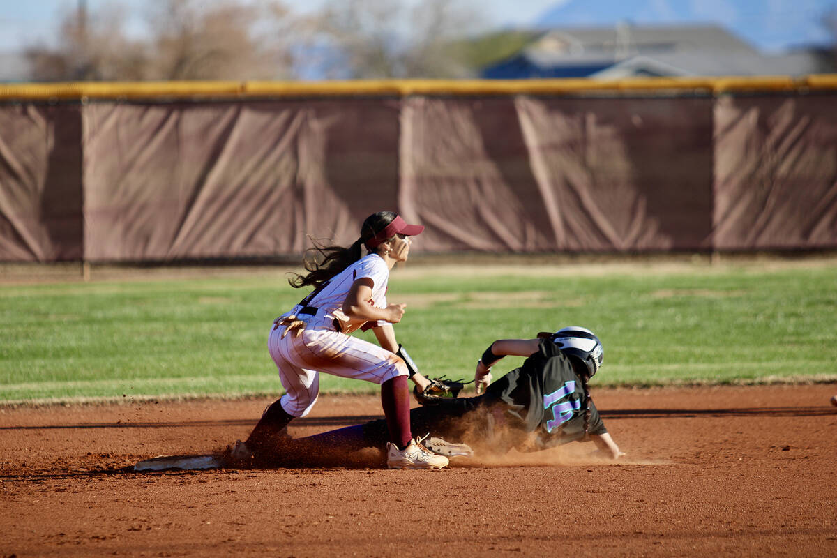 Pahrump Valley High School freshman Aspen Middaugh makes a tag at second base on a throw-down f ...