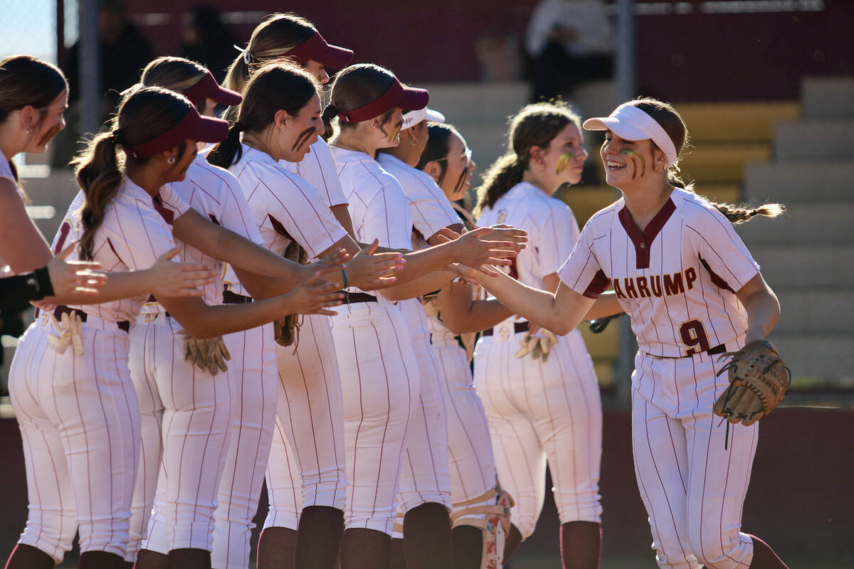 Pahrump Valley High School freshman pitcher Jaycie Hayes is greeted down the line by her teamma ...