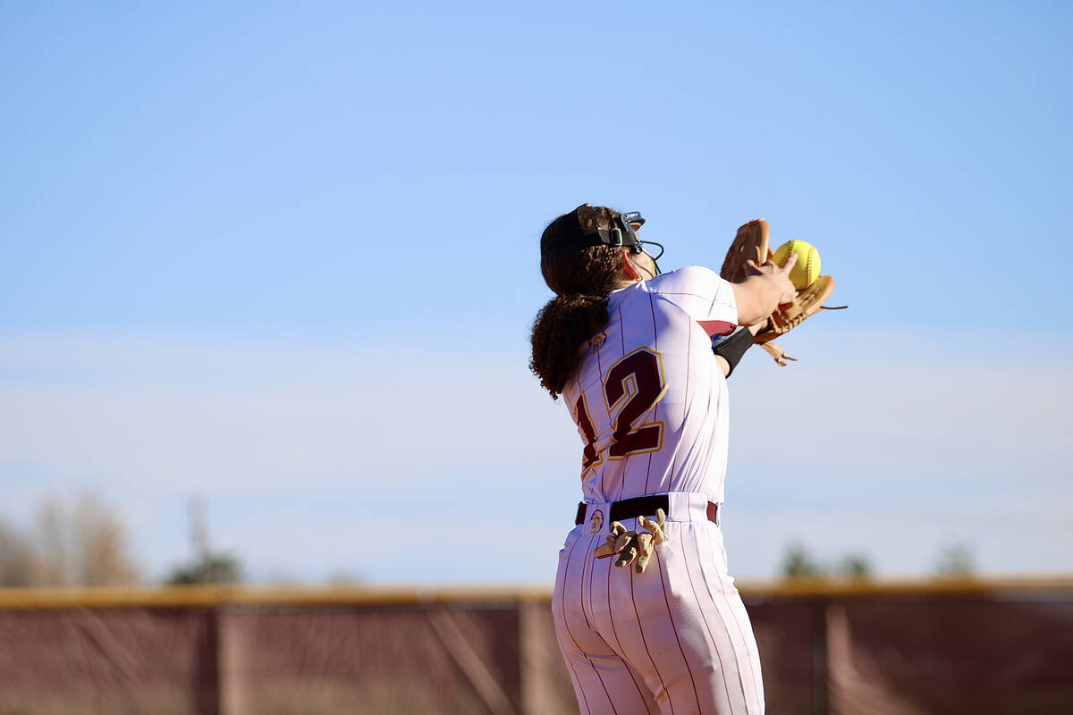 Pahrump Valley High School sophomore C/3B/DP Mariah Gray reaches out for a fly ball with two ha ...