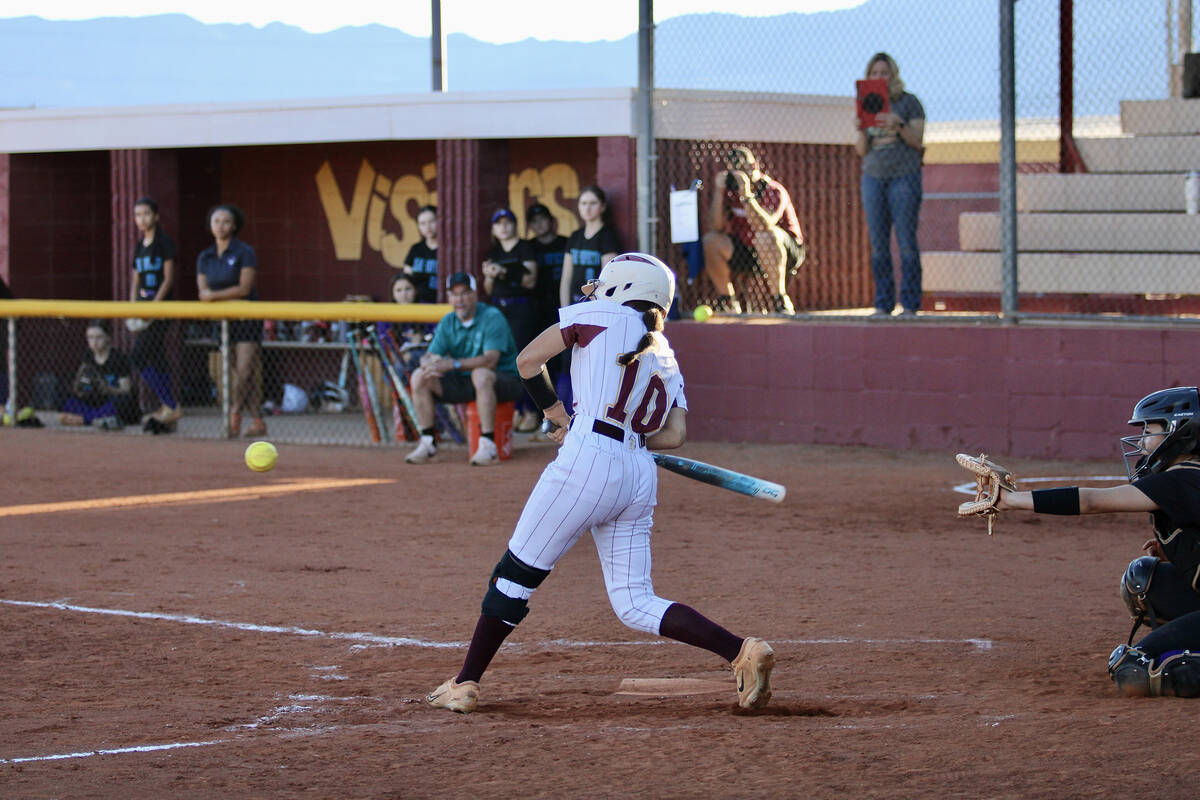 Pahrump Valley High School junior Autumn Colon buts a good bat on the ball during the Trojans' ...