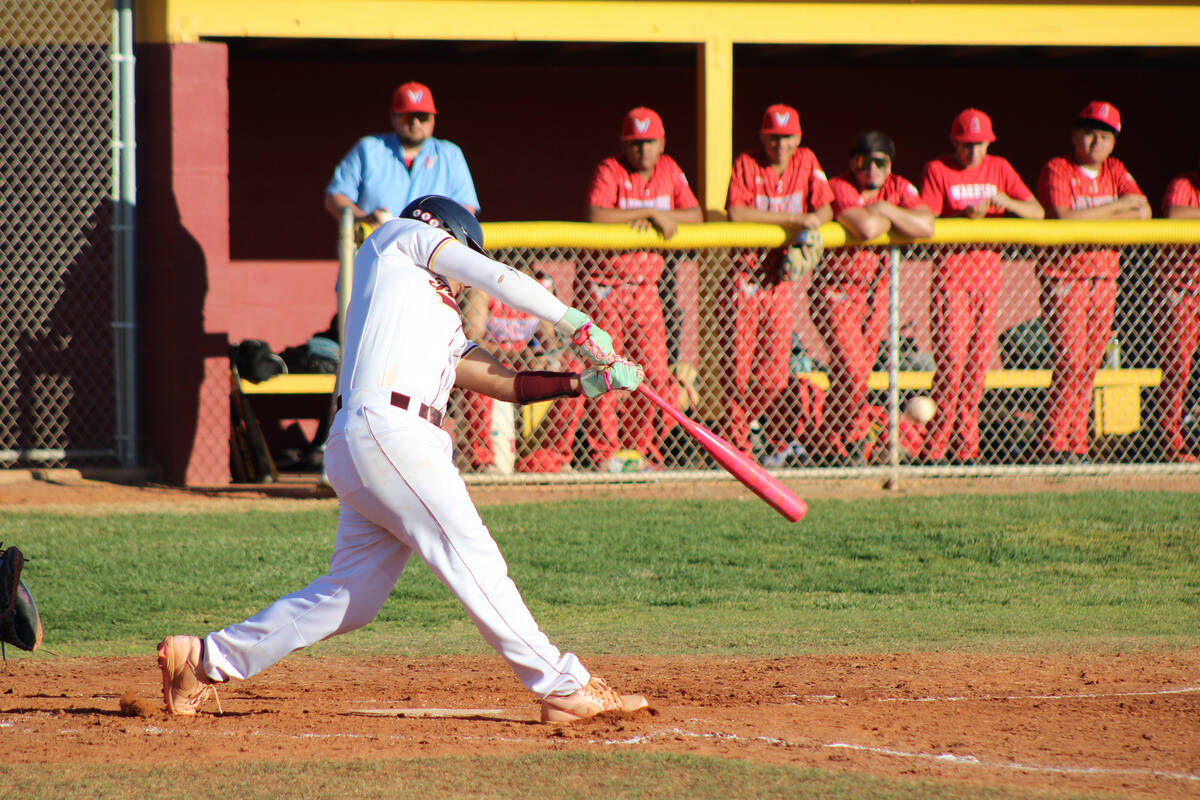 Pahrump Valley High School sophomore CJ Nelson puts a good contact on the ball against Western ...
