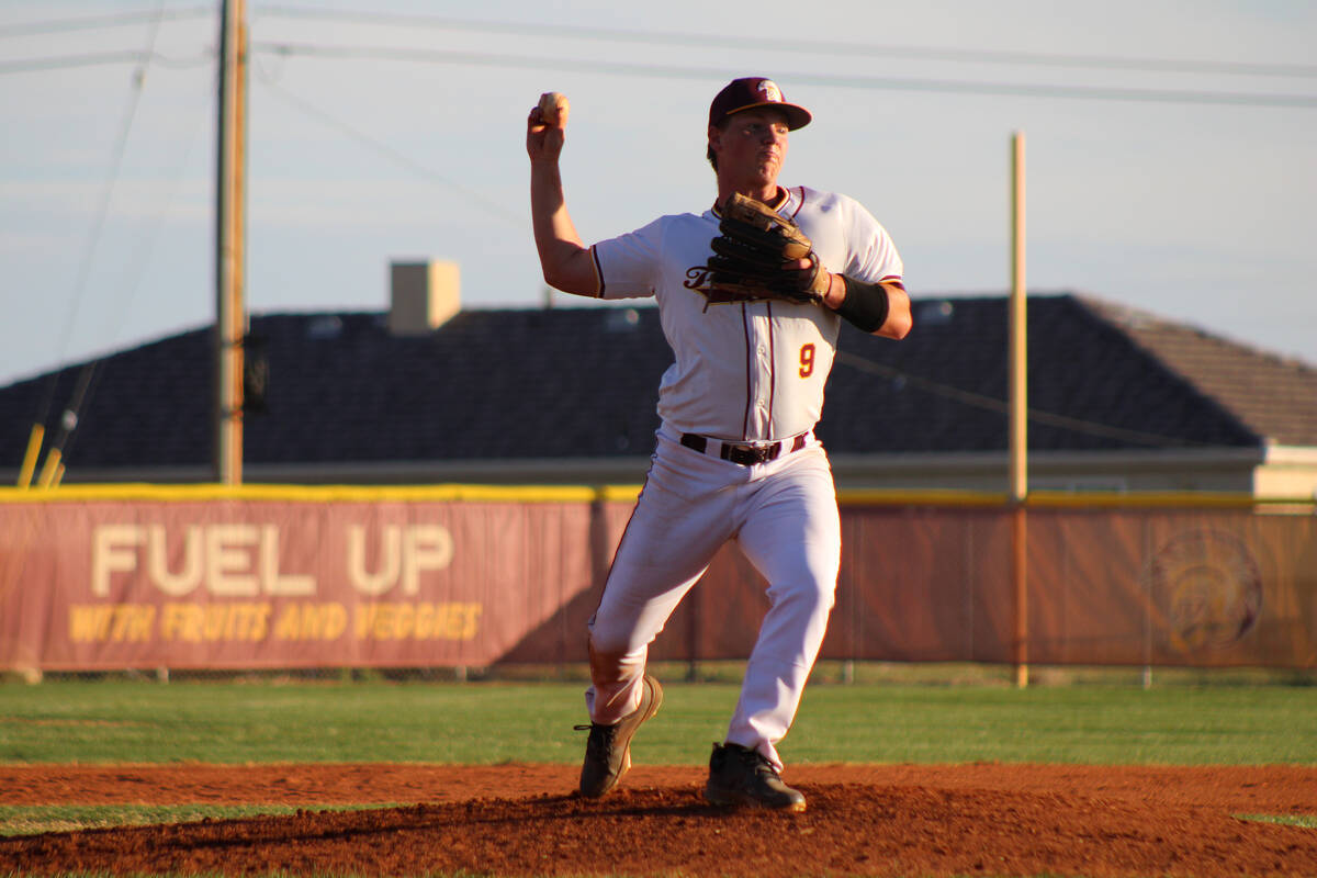 Pahrump Valley High School junior Cody Fried picks off a Western runner at first base during th ...