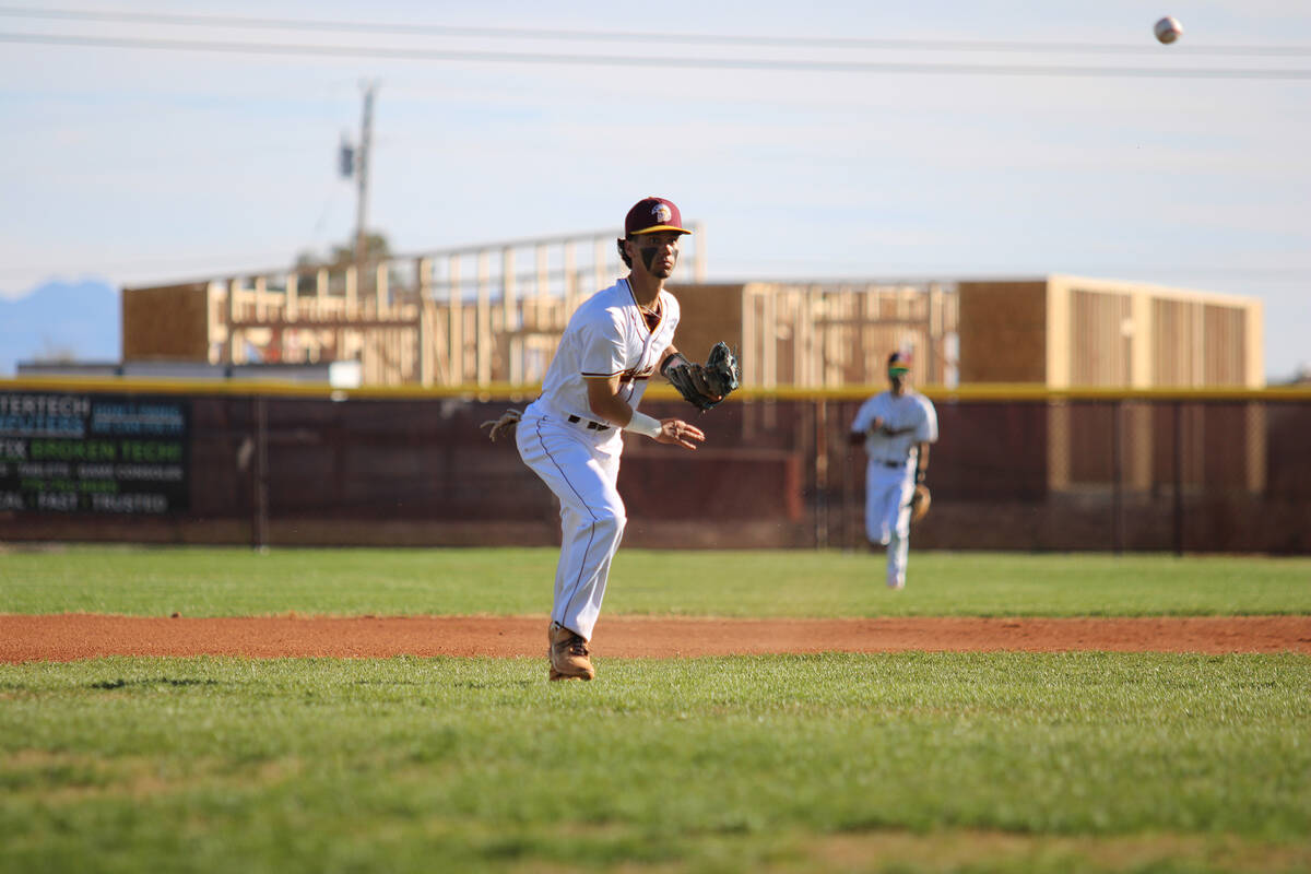 Pahrump Valley High School junior Tony Whitney fields a routine ground ball for the out at firs ...