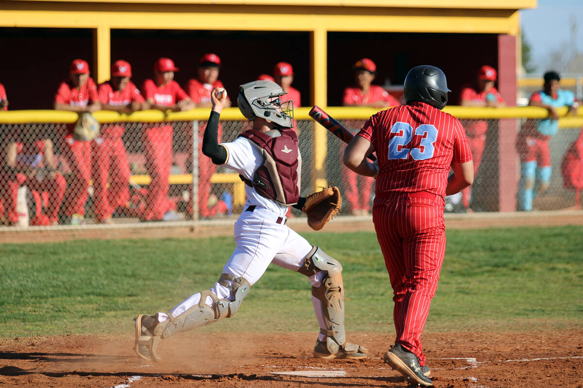 Pahrump Valley High School senior Ben Cimperman throws the ball down the line to third base fol ...