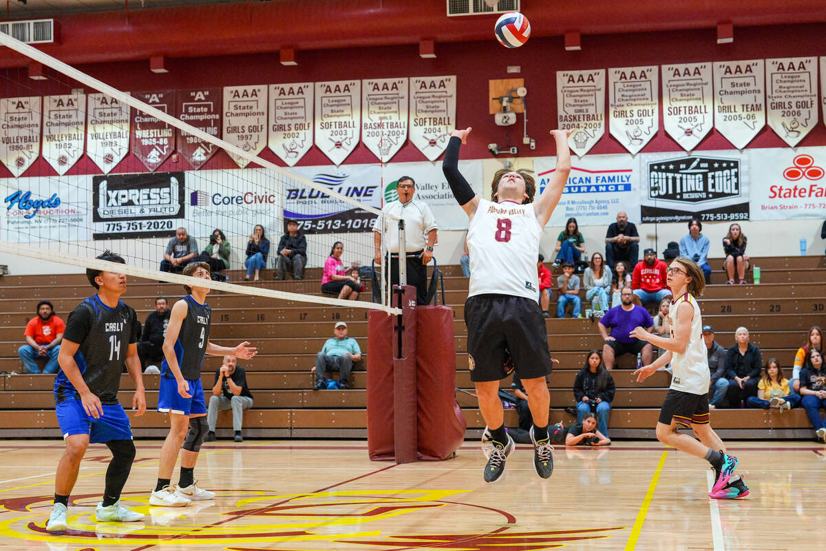Pahrump Valley High School boys volleyball senior Elijah Thompson prepares to set a pass to his ...