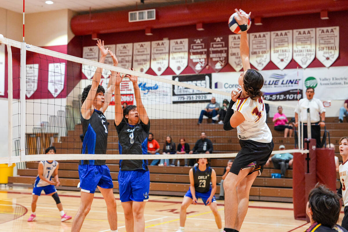 Pahrump Valley High School boys volleyball junior George Anderson gets some air time during an ...