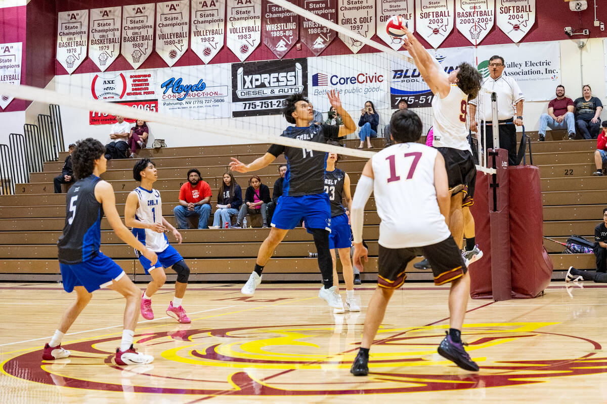Trojans senior Alexander Mahoney attempts to make a block on March 4, 2026, against Coral Acade ...