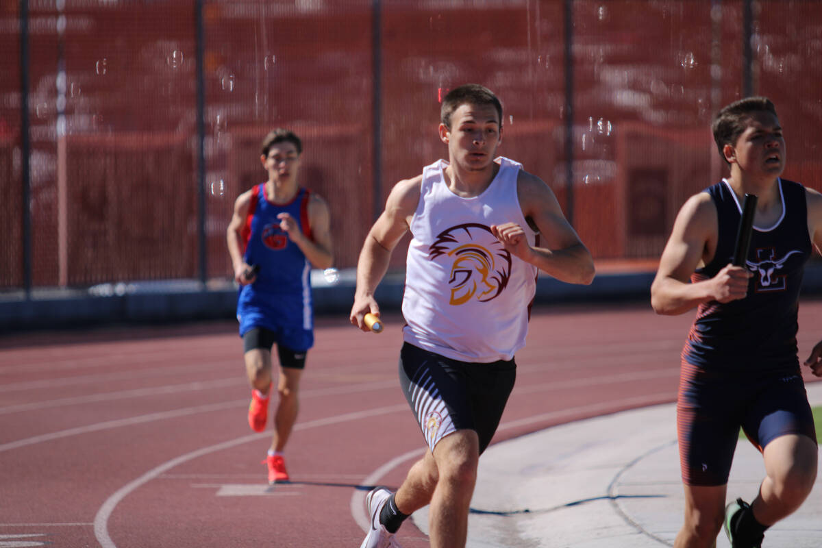 Pahrump Valley High School senior Joshua Slusher takes off during the boys 4x800 race at the Da ...