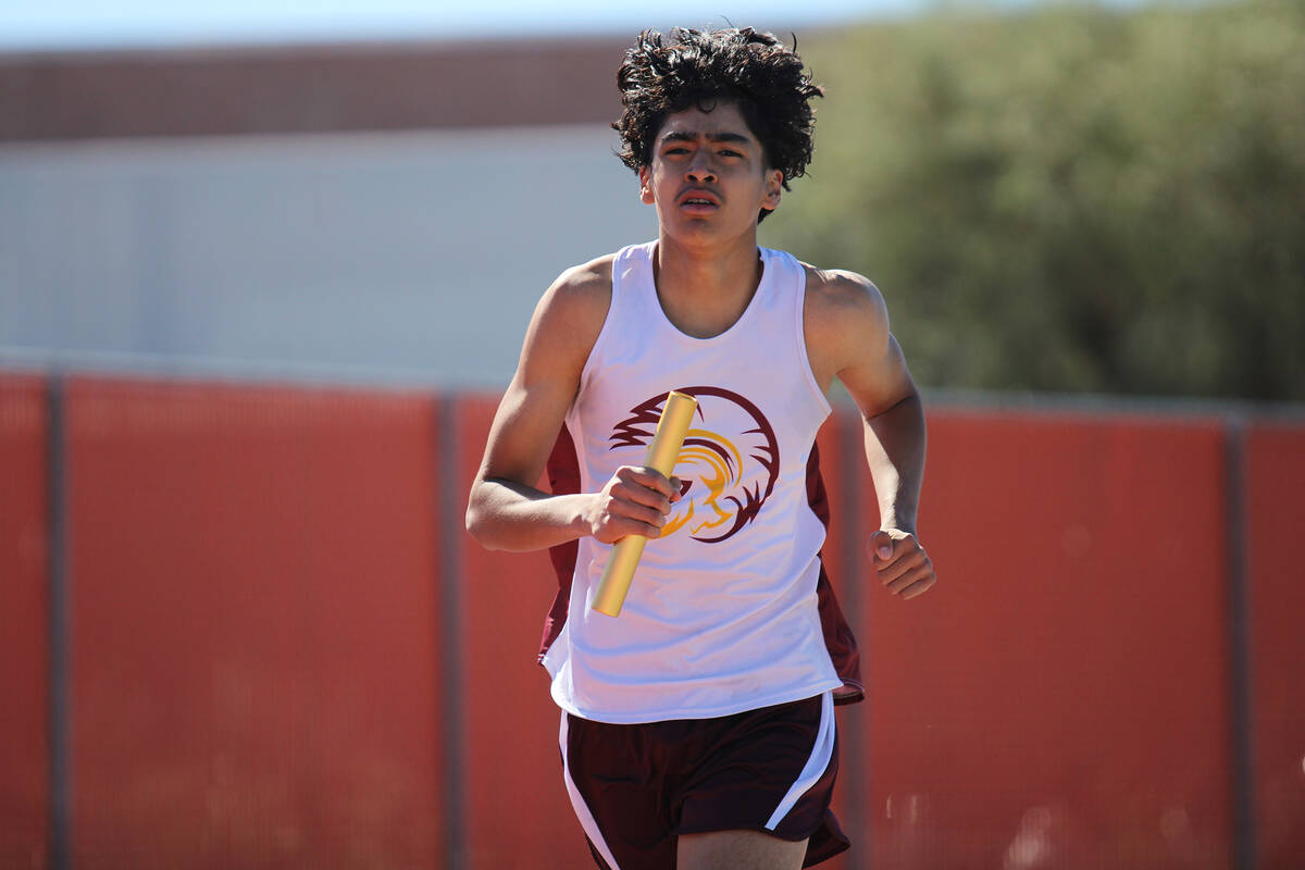 Pahrump Valley High School freshman Kristoffer Trejo does his best to advance the 4x800 team du ...