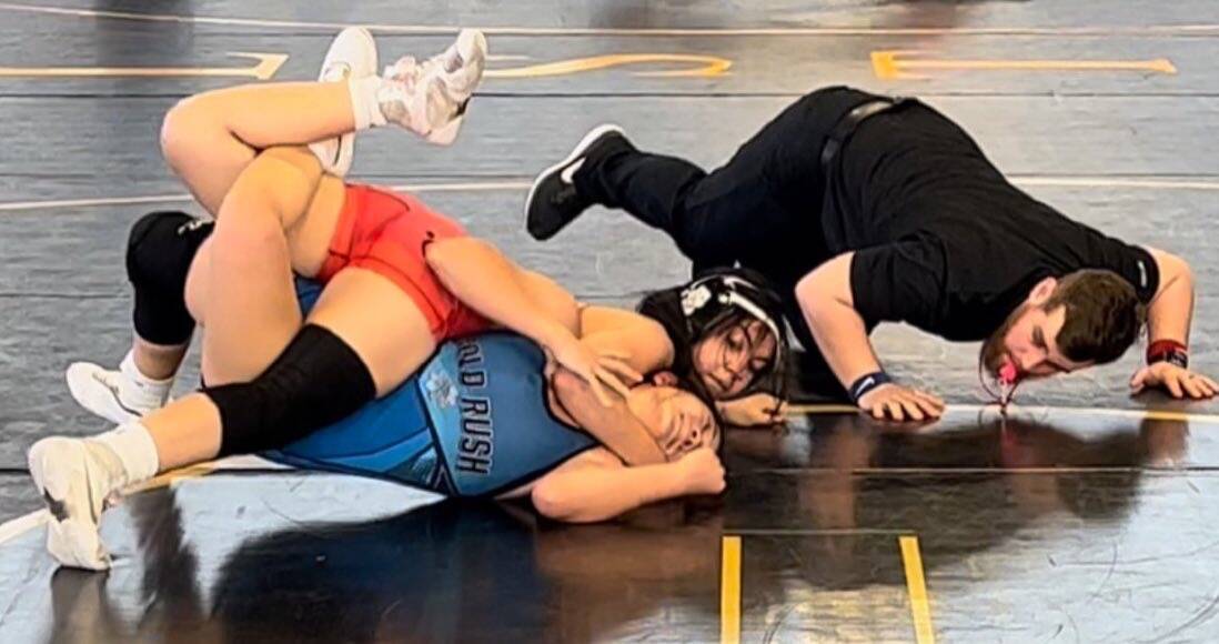 Mika Yoffee nearly lands a pin on her opponent during a high school match. (Marianne Yoffee/Spe ...