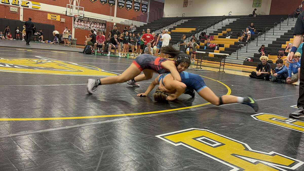 Mika Yoffee tries to maintain control of her opponent during a match wreslting for SLAM! (Maria ...