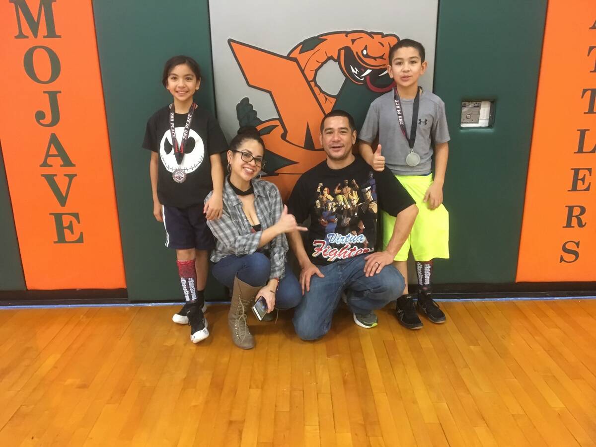 Mika and her family celebrate after a tournament held at Mojave High School. (Marianne Yoffee/S ...