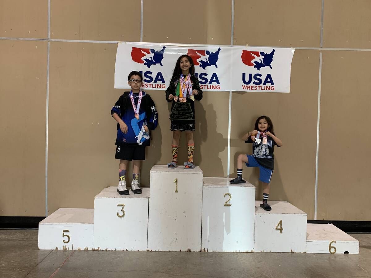 Mika Yoffee stands on the podium following a youth tournament. (Marianne Yoffee/Special to the ...