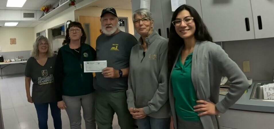From left: Susie Jackson, volunteer; Rosalee Clasen, vice president of American First National ...