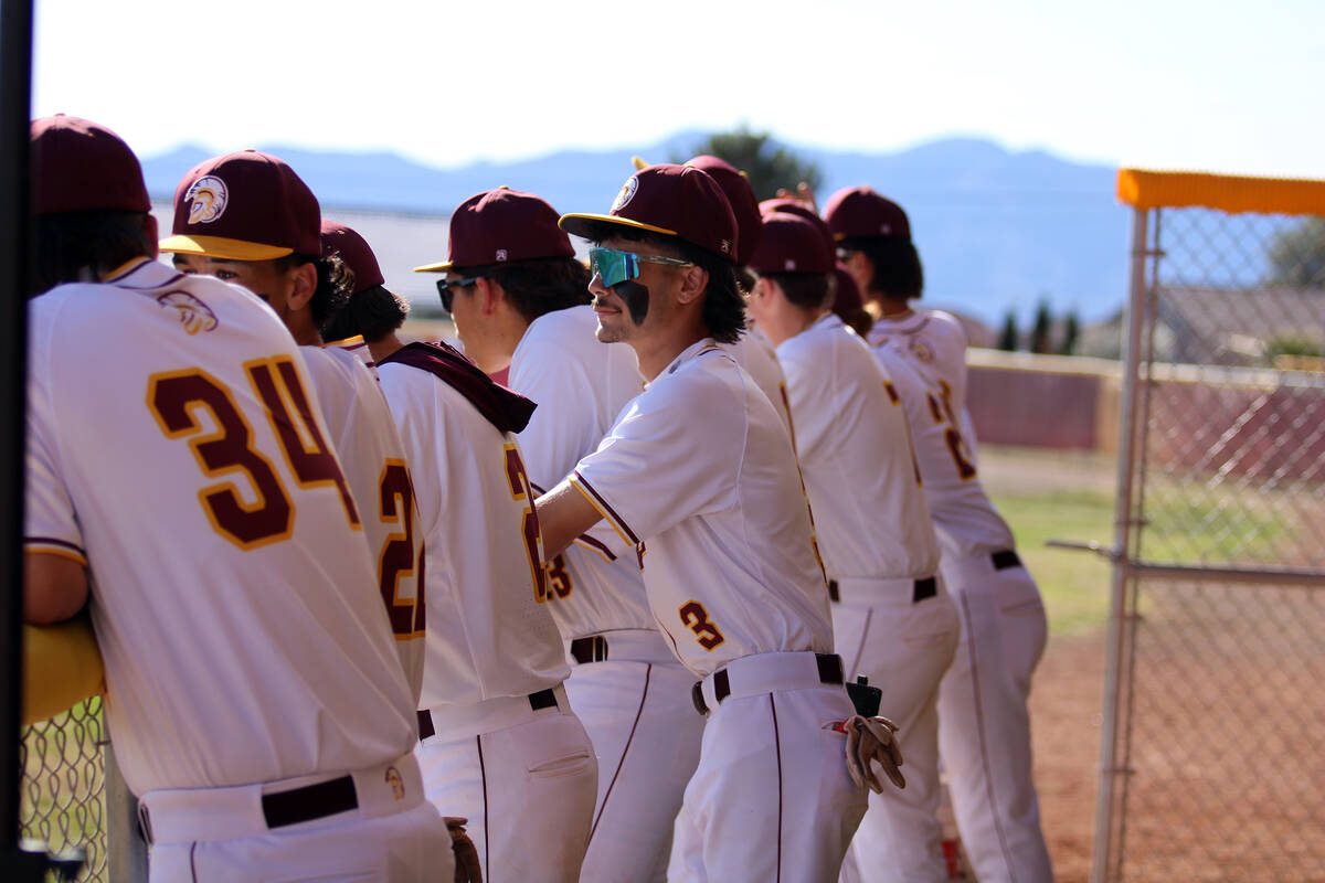 Members of the Pahrump Valley High School baseball team hangout on in the dugout prior to the s ...