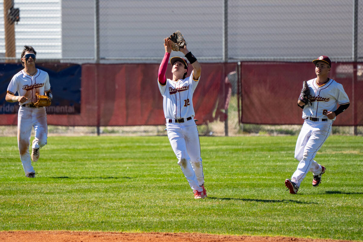 Pahrump Valley High School sophomore Anthony Montanez gets into position to catch a shallow fly ...