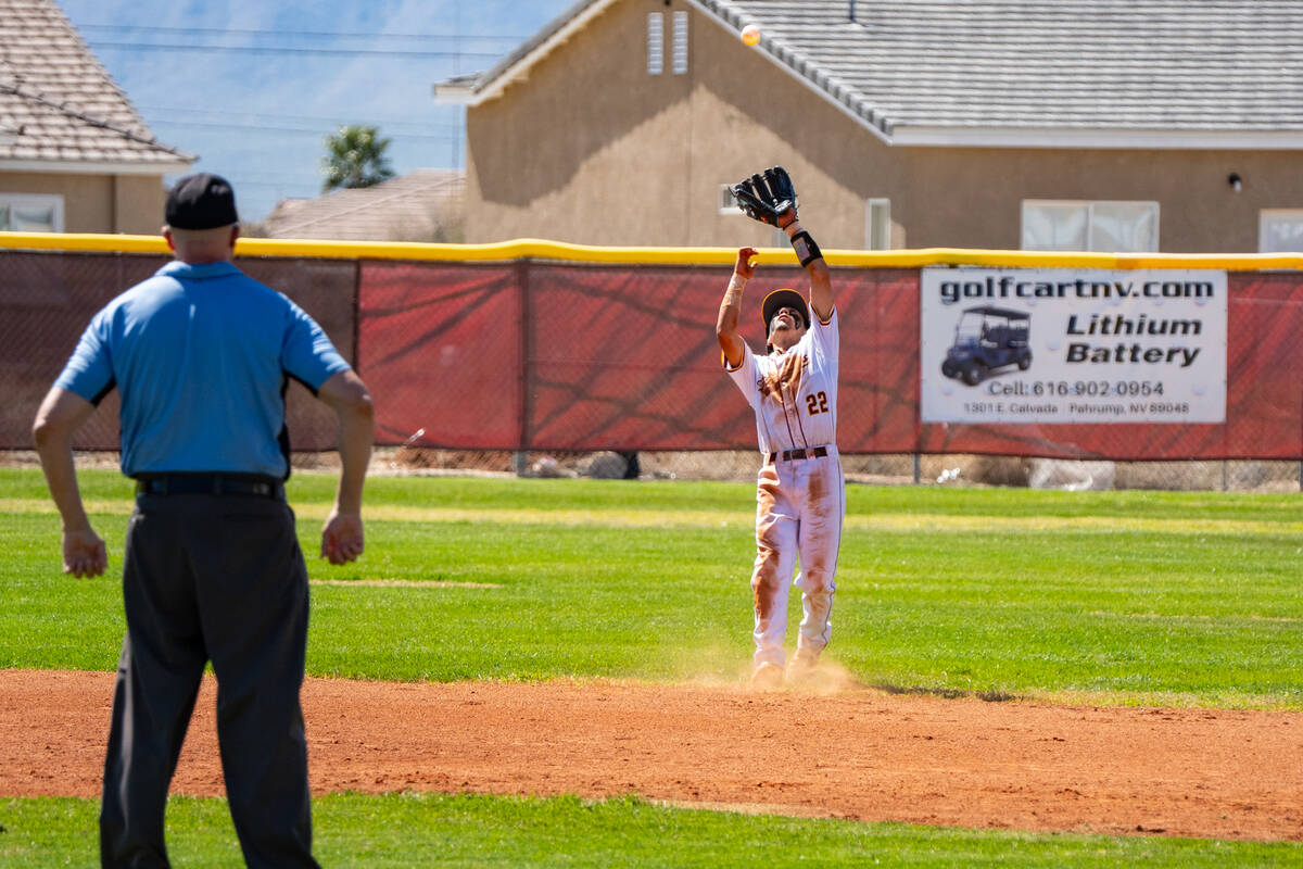 Pahrump Valley High School shortstop Tony Whitney attempts to get two hands on the ball during ...