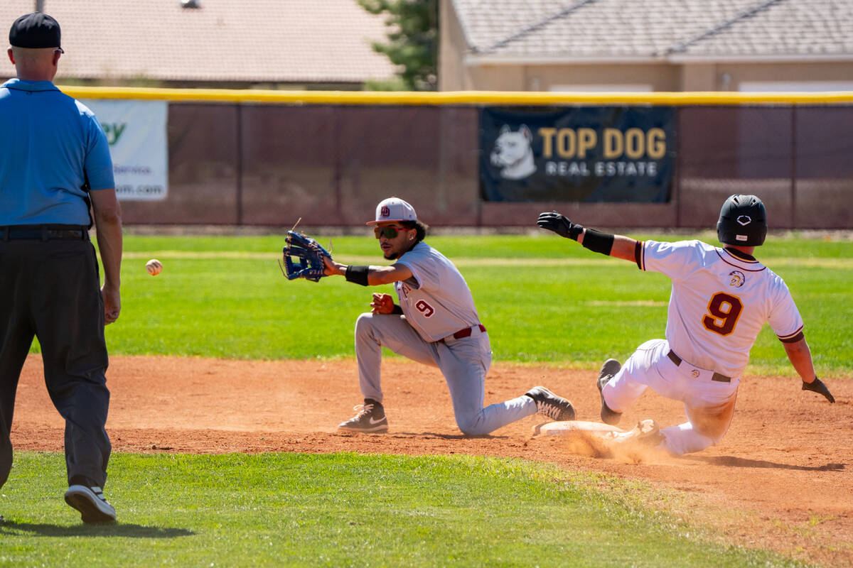 Pahrump Valley High School senior Cody Freid attempts to safely steal second base during a non- ...