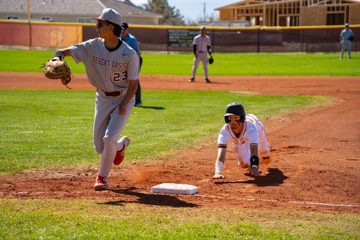 Pahrump Valley High School junior Tony Whitney attempts to make it back safely during a back-pi ...