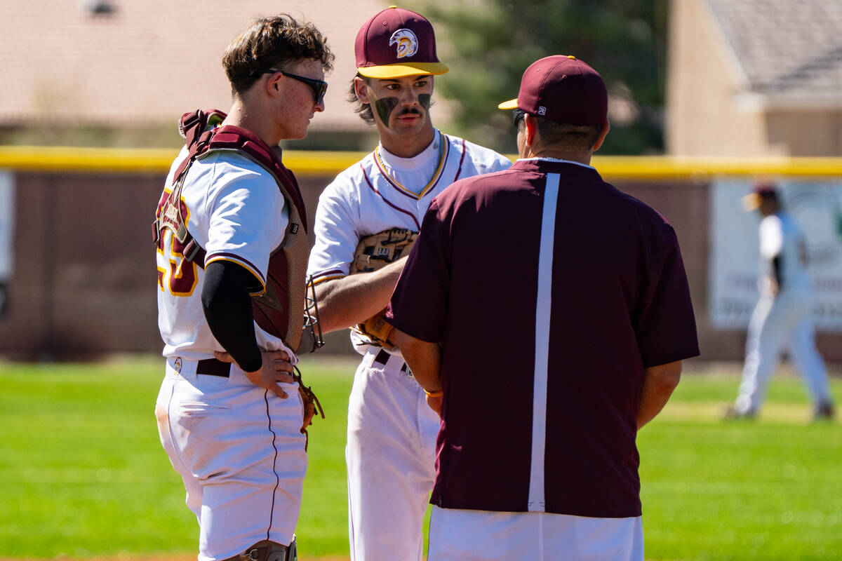Pahrump Valley High School varsity baseball assistant coach Brandon Bietar heads out to the mou ...