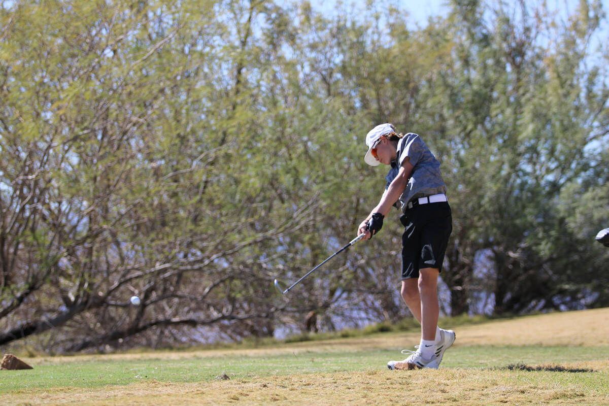 Pahrump Valley High School sophomore Tanner Gott clubs a ball deep down the El Dorado Valley co ...