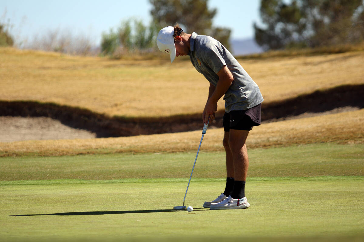 Pahrump Valley High School junior Travis Floyd attempts to round out middle hole on the back 18 ...