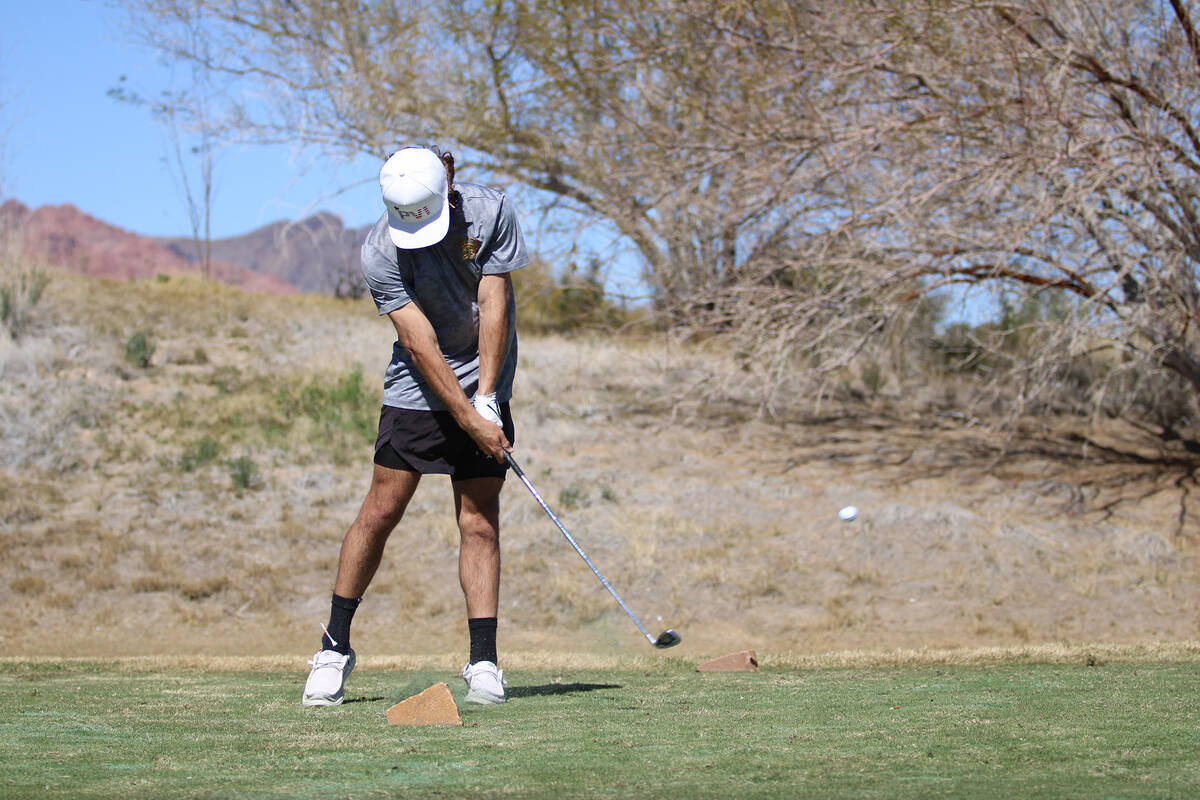 Pahrump Valley High School junior Travis Floyd follows through on a swing during the Boulder Cr ...