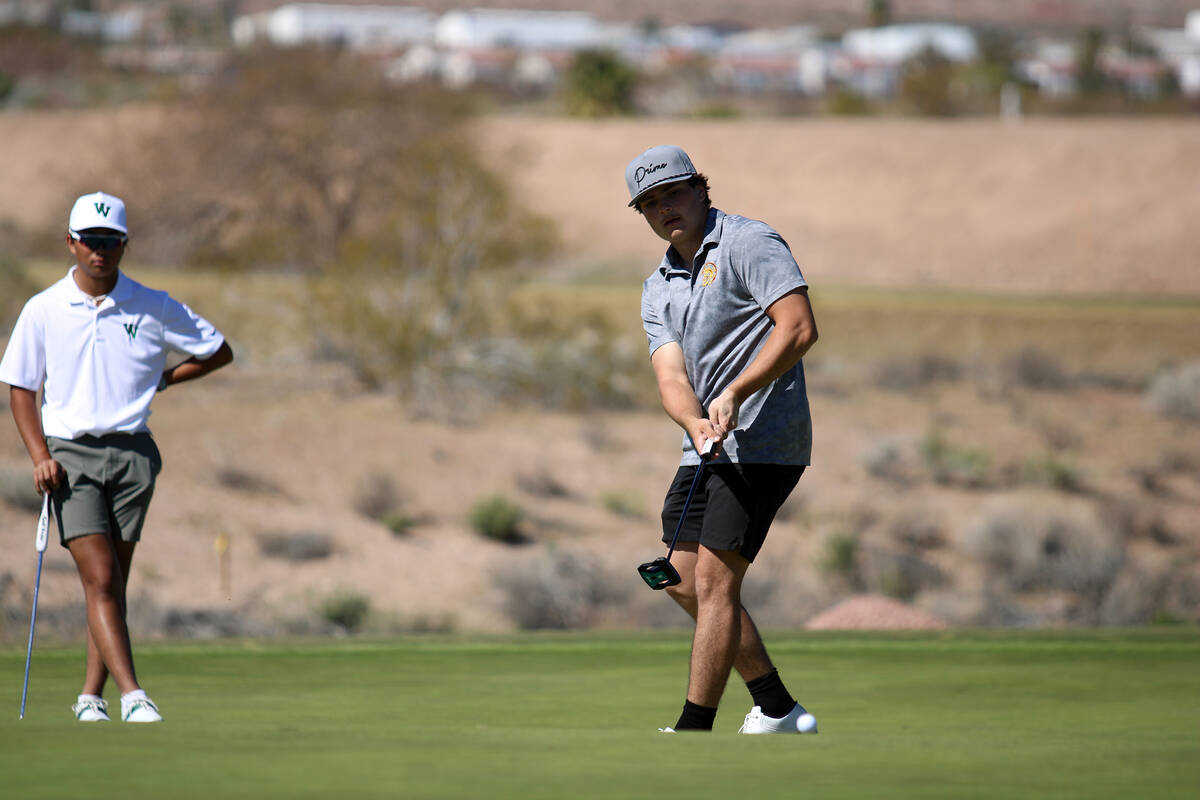 Pahrump Valley High School junior Aaron Riley attempts to finish a hole on the Coyote Run cours ...