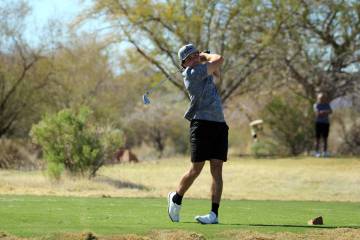 Pahrump Valley High School junior Aaron Riley attempts to finish a hole on the Coyote Run cours ...
