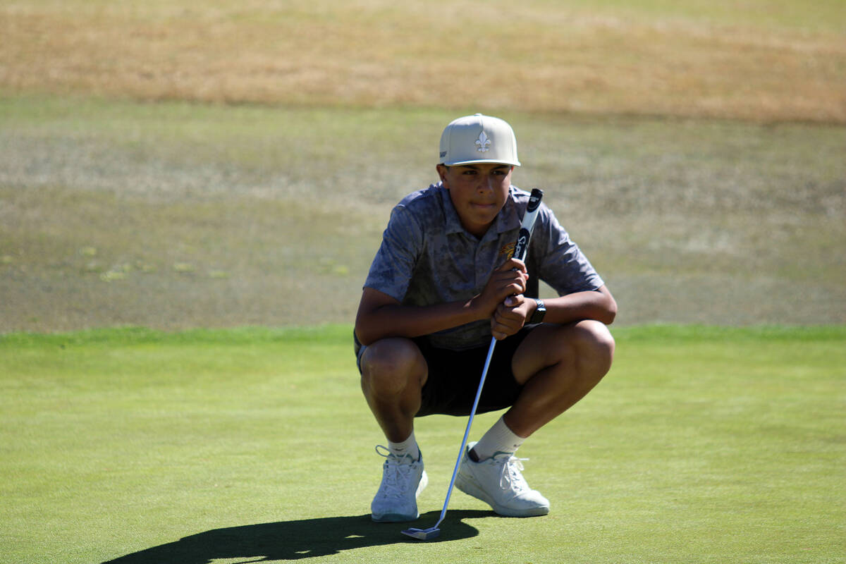 Pahrump Valley High School sophomore Samson Wagner sizes up a putt during the Boulder creek mee ...