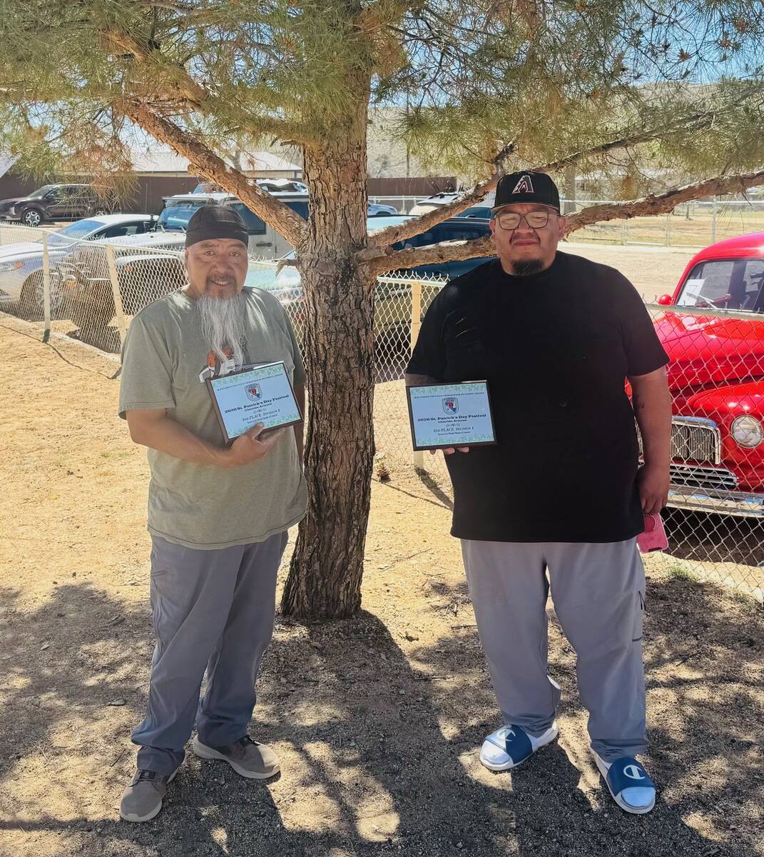 SNHPS pitchers Bryant Smith III and Bryant Smith Jr. proudly display their second-place divisio ...