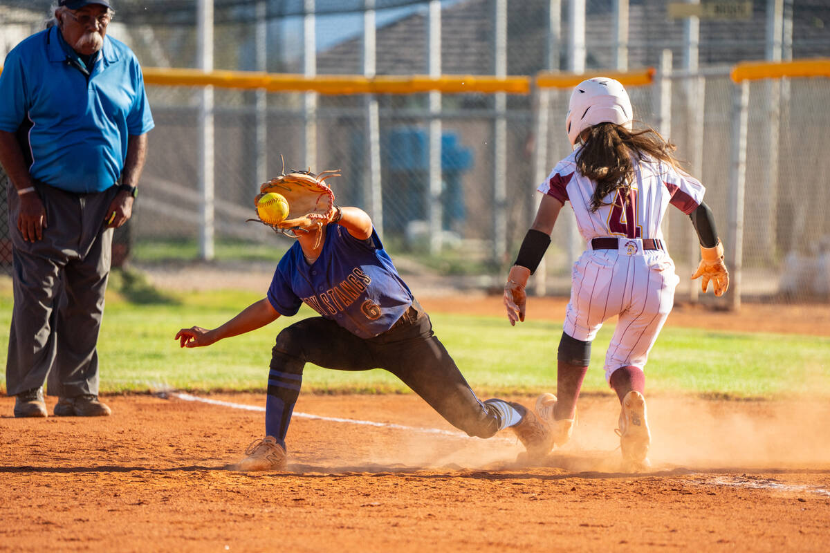 Pahrump Valley High School freshman shortstop Aspen Middaugh beats out a throw at first base ag ...